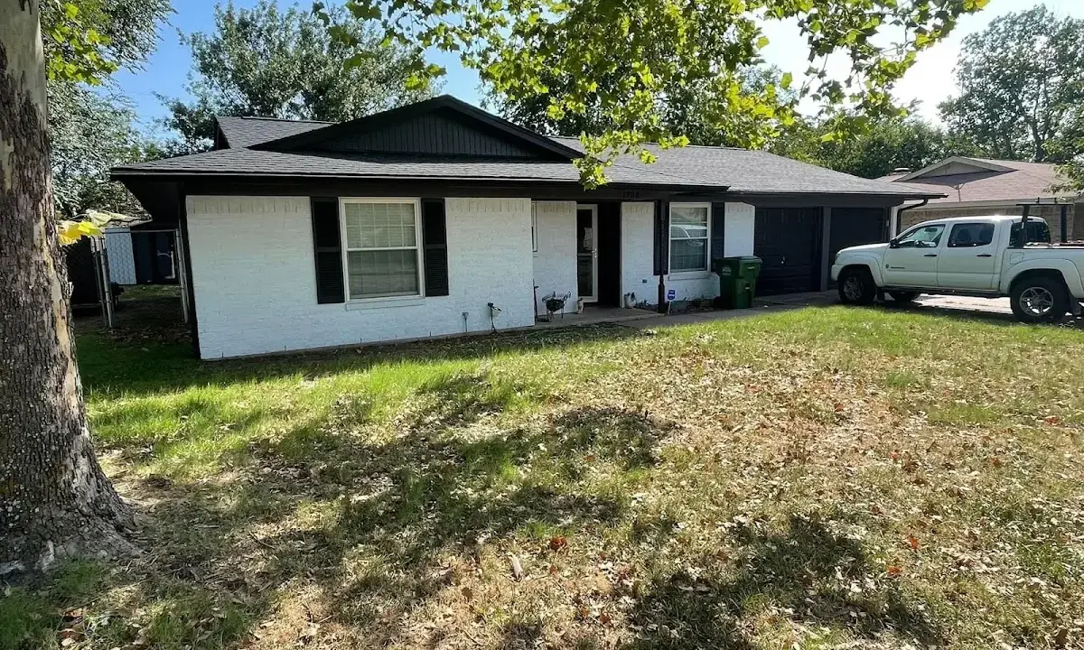 Professional roofing crew working on a residential roof in Montgomery